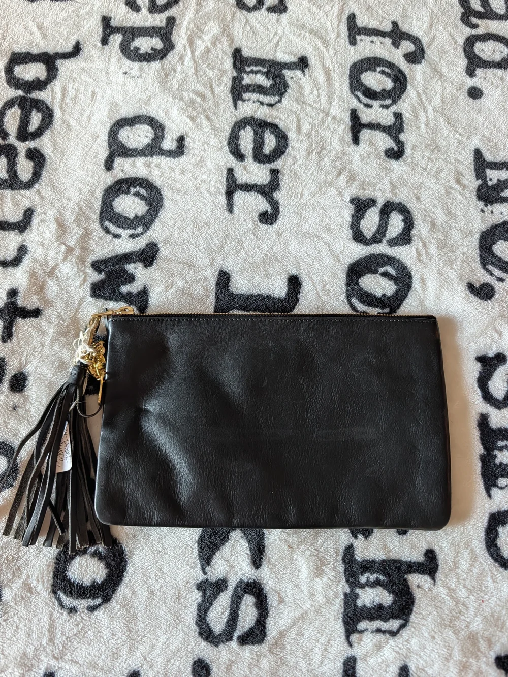 Black Leather Tassel Wristlet Clutch with Gold Accents